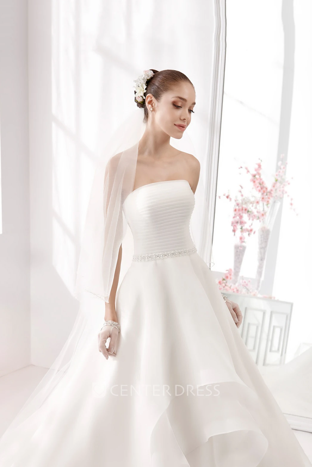 Strapless A-Line Wedding Gown With Pleated Bodice and Asymmetrically Ruffled Skirt