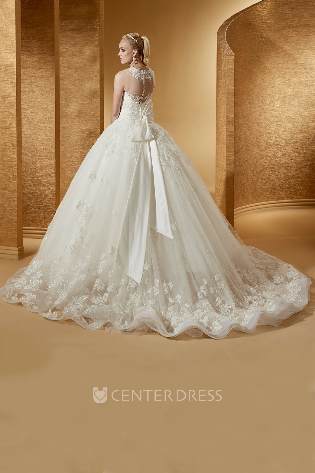 Feminine Cap Sleeve Ball Gown With Illusive Neckline And Back Bow