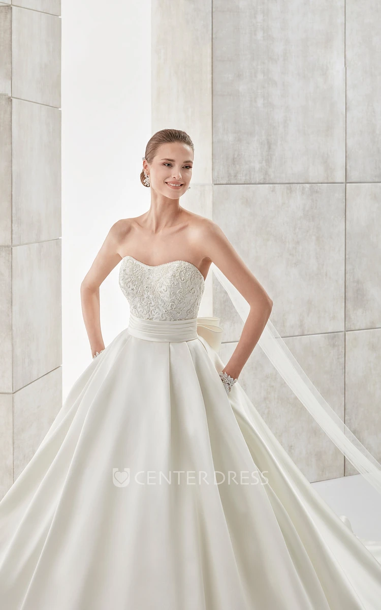 Strapless A-line Wedding gown with Cinched Waistband and Back Bow
